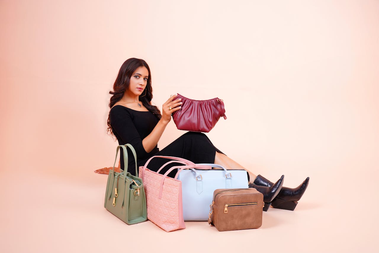 services-01 Stylish model showcasing a collection of designer handbags in Lahore.